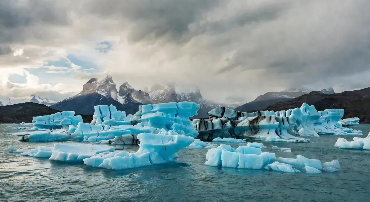 Massive turquoise icebergs calved from Grey Glacier floating on Lago Grey inside Torres del Paine National Park, Chilean Patagonia — visible on all full-day guided tours